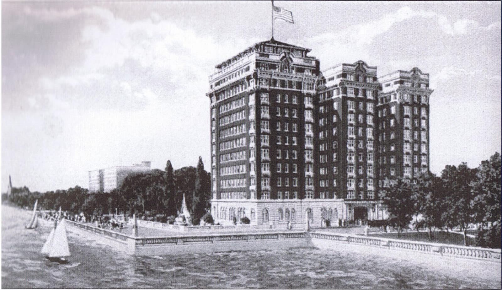 The Sisson Hotel rising over the Hyde Park lakefront around 1920, with sailboats on the water in front of it